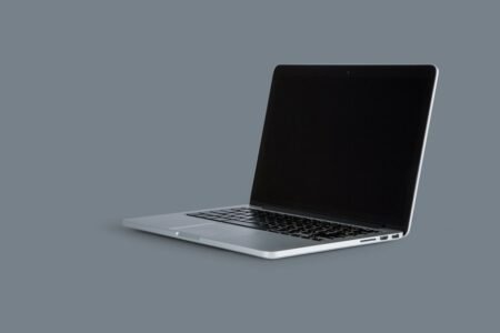 Laptop workspace for prompt engineering and AI tutorials